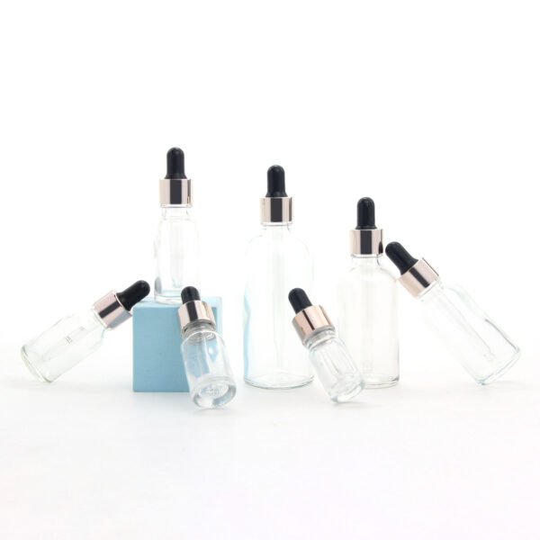 round transparent glass essential oil bottle with dropper