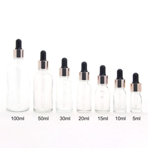 round transparent glass essential oil bottle with dropper