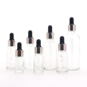 round transparent glass essential oil bottle with dropper