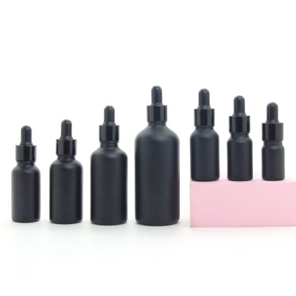 round matte black glass essential oil bottle with dropper