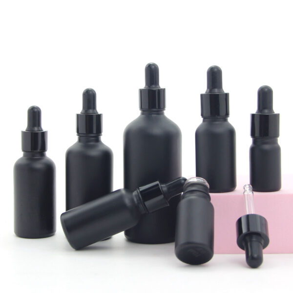 round matte black glass essential oil bottle with dropper