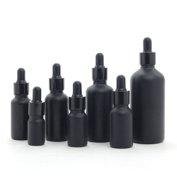 round matte black glass essential oil bottle with dropper