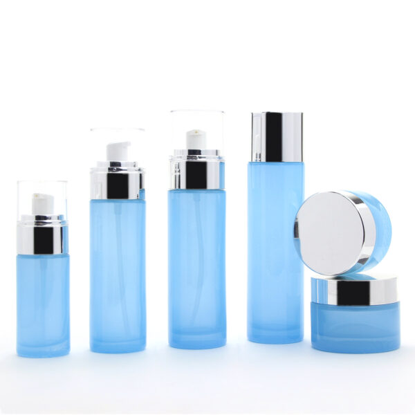 cylinder blue glass cosmetic bottle and jar