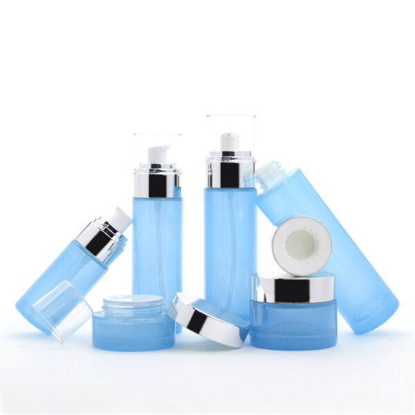 cylinder blue glass cosmetic bottle and jar