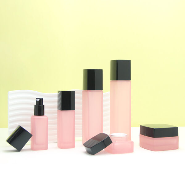 square pink glass cosmetic bottle and jar